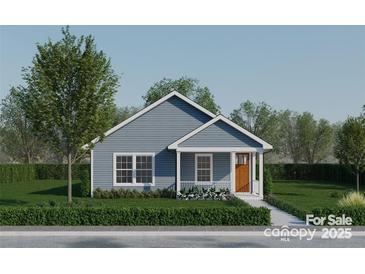 Charming home features a covered front porch, blue siding, white trim, and a well-manicured lawn at 0 Tanglewood Dr # 6, Salisbury, NC 28144