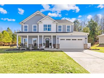 Charming two-story home featuring a welcoming front porch and a well-manicured lawn at 146 Allenton Way, Statesville, NC 28677