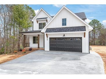 Charming new construction home featuring a two-car garage and a welcoming front porch at 3646 46Th Ne Ave, Hickory, NC 28601