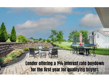 Charming outdoor patio with comfortable seating, a fire pit, and views of the backyard at 137 Tenth Green Ct, Statesville, NC 28677