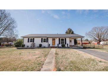 Charming single-story home with well-maintained lawn and inviting curb appeal at 3029 Wendover Nw Rd, Concord, NC 28027