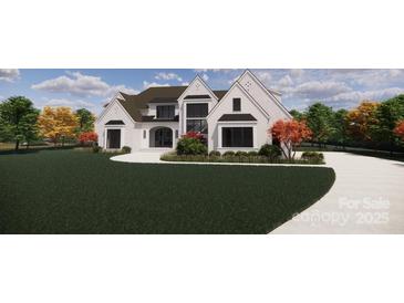 Stunning two-story home with a white brick exterior, black trim windows, manicured lawn, and ample curb appeal at 1017 Broadmoor Dr # 60, Marvin, NC 28173