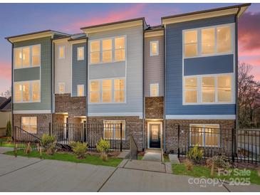 Beautiful new townhomes featuring brick accents, professional landscaping and stylish modern design at 3928 Craig Ave, Charlotte, NC 28211