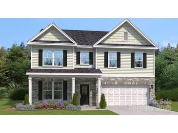 Charming two-story home with stone accents, a welcoming front porch, and a well-manicured lawn at 4022 Vista Pine Dr, Charlotte, NC 28215