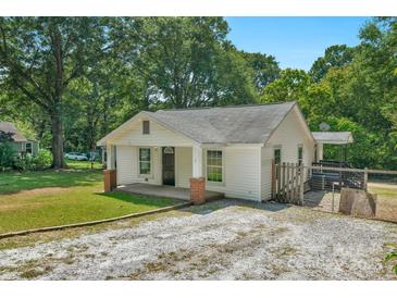 Charming single-story home featuring a welcoming front porch and a well-maintained lawn at 233 Proctor St, Gastonia, NC 28052