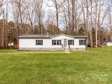 Charming single-story home with well-maintained lawn and classic white siding at 236 Sailwinds Rd, Mooresville, NC 28115