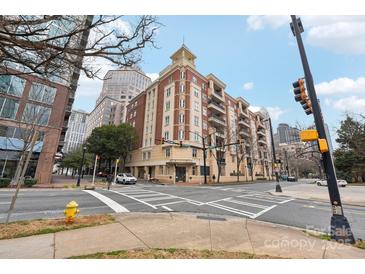 Attractive multi-story brick building with tan trim and balconies on a city street corner at 572 N Church St, Charlotte, NC 28202