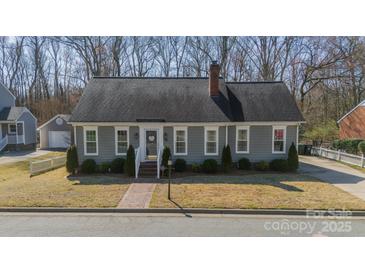 Charming single-story home with a brick walkway, well-kept lawn, and inviting curb appeal at 285 Fryling Sw Ave, Concord, NC 28025