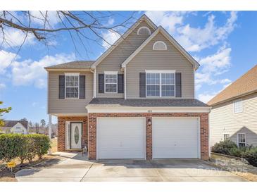 Charming two-story home with a two-car garage and well-maintained landscaping at 803 Coach House Ct, Rock Hill, SC 29730