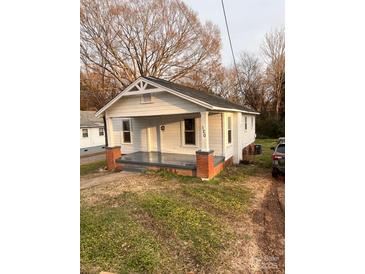 Charming single-story home with a welcoming front porch and well-maintained lawn at 120 3Rd Ave, Conover, NC 28613