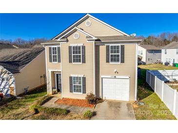 Charming two-story home with a single car garage, complemented by black shutters and well-kept landscaping at 6523 Matlea Ct, Charlotte, NC 28215