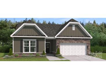 Charming single Gathering home boasting stone accents, neutral colors and a two car garage at 2014 Mantle Ridge Dr, Indian Trail, NC 28079