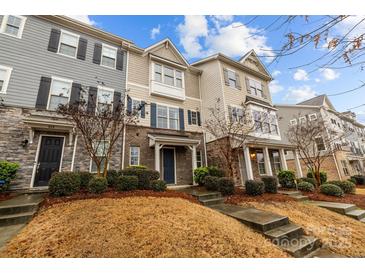 Charming townhomes boast mixed siding, stone accents, and well-maintained landscaping at 824 Imperial Ct, Charlotte, NC 28273