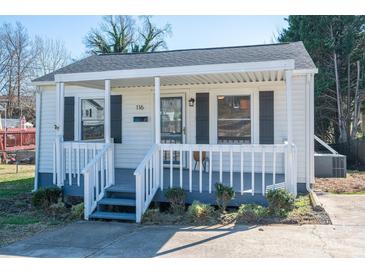 Charming single-story home with a covered front porch, gray shutters, and landscaped yard at 116 Garrison Dr, Belmont, NC 28012