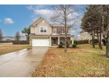 Charming two-story home with a brick and siding exterior, attached garage, and well-manicured lawn in a suburban neighborhood at 128 Lacona Trce, Mooresville, NC 28115