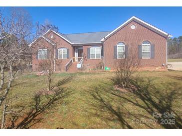 Charming single-story brick home with a well-manicured lawn and inviting front entrance at 1638 Bess Town Rd, Bessemer City, NC 28016