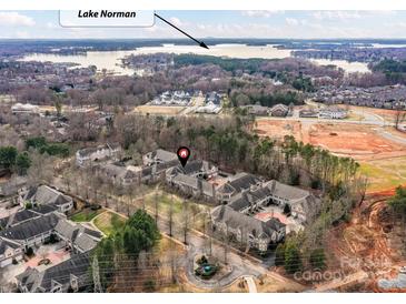 A beautiful neighborhood from above with the stunning Lake Norman in the background at 8925 Rosalyn Glen Rd, Cornelius, NC 28031