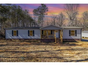 Charming single-story home with a covered porch and well-maintained yard at 1645 Stony Point Rd, Shelby, NC 28150