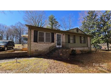 Charming single-story brick home featuring a well-manicured lawn and classic architectural details at 509 California Cir, York, SC 29745