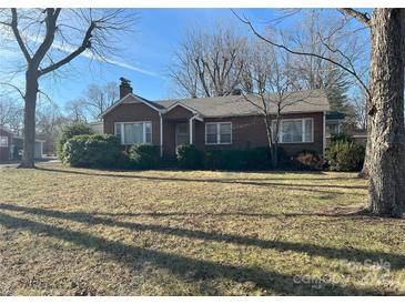 Charming brick home with a well-maintained front yard and mature trees at 708 Mount Olive Church Rd, Newton, NC 28658