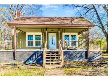 Charming home with a covered front porch, decorative railings, and a welcoming entrance at 1759 Smith Ave, Gastonia, NC 28052
