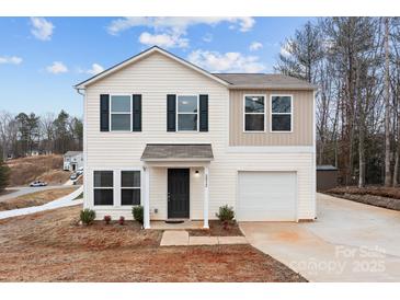 Charming two-story home with neutral siding, black shutters, and an attached one car garage at 2032 Country Pl, Hickory, NC 28601