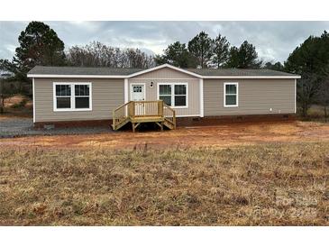 Charming single-story home with neutral siding, complemented by a small porch and classic windows at 238 Fairchase Cir # 54, Stony Point, NC 28678