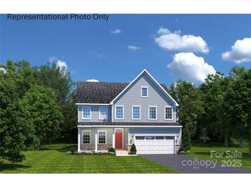 Charming two-story home with a well-manicured lawn, attached two-car garage, and a classic red front door at 1809 Ab Moore Jr Dr # 3238, Indian Trail, NC 28079
