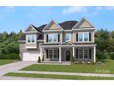 Beautiful two-story home featuring stone accents, black shutters, and a covered front porch at 304 Balboa St, Matthews, NC 28104