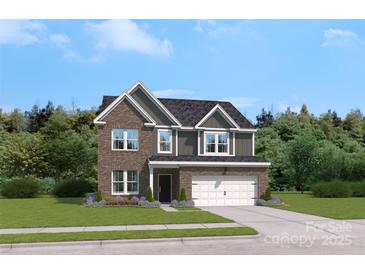 Charming two-story home with a brick facade, attached garage, and well-manicured lawn at 419 Balboa St, Matthews, NC 28104