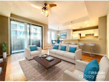 Bright living room with modern furnishings and open concept design at 718 W Trade St # 302, Charlotte, NC 28202