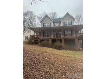 Charming two-story home featuring a spacious front porch perfect for enjoying the outdoors at 369 Falcon Dr, Concord, NC 28025