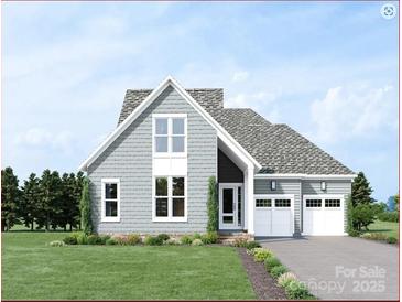 Charming two-story home boasts a two-car garage, manicured lawn, and classic design at 4465 Morning Mist Dr # 54, Sherrills Ford, NC 28673