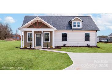 Charming single-story home features a welcoming front porch, neatly landscaped yard, and a gray-shingled roof at 2867 W Zion Church Rd, Shelby, NC 28150