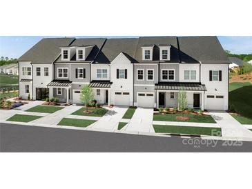 Charming townhome exteriors with well-manicured lawns, driveways and black accent roofing at 3020 Finchborough Ct # 230, Charlotte, NC 28269