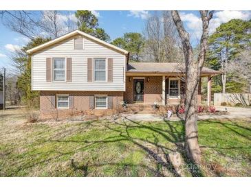 Charming home featuring a symmetrical facade, complemented by a well-maintained front yard at 132 Stoneybrook Rd, Salisbury, NC 28147