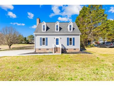 Charming two-story home with dormer windows and blue shutters, set on a well-maintained lawn at 2927 Forest Hills Cir, Rock Hill, SC 29732