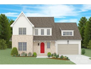 Charming two-story home with a brick and white facade, complemented by a red door and attached garage at 4735 Elder Ave, Charlotte, NC 28205