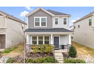 Charming two-story home with gray accents, landscaped front yard, and covered porch at 12224 Diablo St, Huntersville, NC 28078