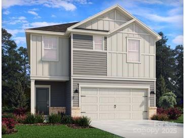 Charming two-story home featuring a two-car garage, neutral siding, and a well-manicured lawn at 5201 Georgette Trl, Cherryville, NC 28021