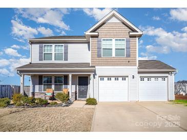 Charming two-story home with a well-manicured lawn and a three-car garage at 133 Galley Ln, Statesville, NC 28677