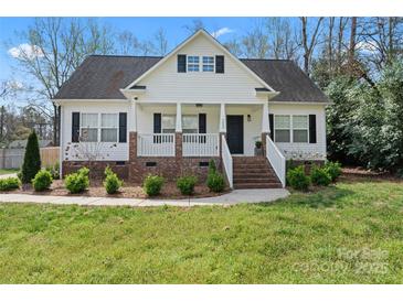 Charming home with a inviting front porch, brick accents and well-maintained landscaping at 4053 Crestview Dr, Rock Hill, SC 29732