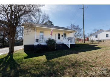 Charming home featuring a welcoming front porch and well-maintained lawn in a residential neighborhood at 206 Mcconnell St, Clover, SC 29710