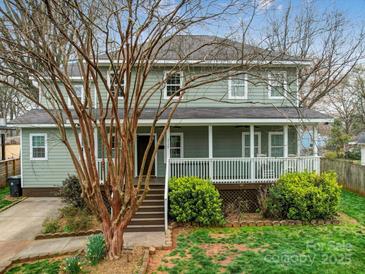 Charming two-story home with a welcoming front porch and well-maintained landscaping at 2729 Duncan Ave, Charlotte, NC 28205