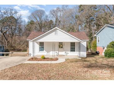 Charming single-story home with a welcoming front porch, well-maintained lawn and cozy curb appeal at 1003 Harris St, Kannapolis, NC 28081