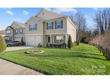 Charming two-story home with well-manicured lawn and inviting curb appeal in a desirable neighborhood at 3428 Orr St, Charlotte, NC 28269