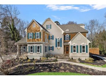 Charming traditional home with a landscaped front yard and inviting entrance at 888 Craigmont Nw Ln, Concord, NC 28027