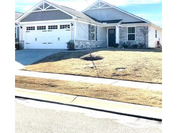 Charming single-story home showcasing a two-car garage and well-maintained front lawn at 247 Damask Dr, Lancaster, SC 29720