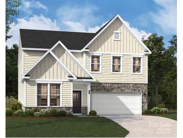 New two-story home with stone accents, attached garage, and manicured lawn at 4027 Vista Pine Dr, Charlotte, NC 28215