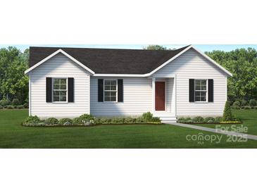 Charming single-story home with white siding, black shutters, and a well-manicured lawn at 703A W Carolina Ave, Bessemer City, NC 28016